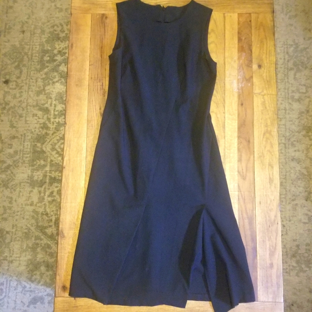 Simple, classic black dress with cutout hemline